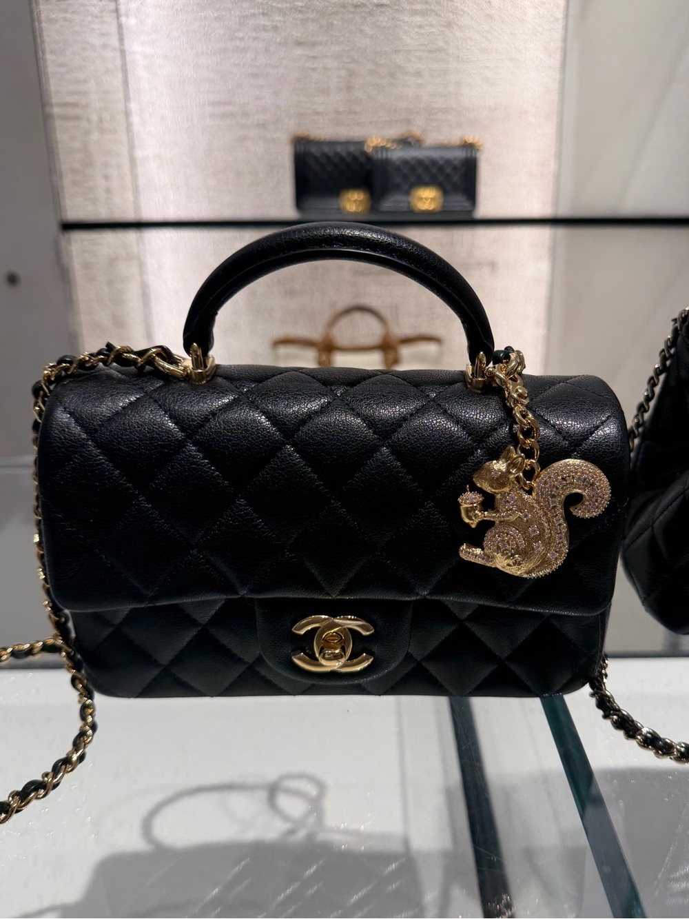 CHANEL squirrel charm accessory